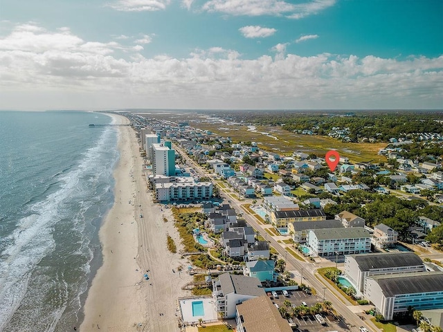 aerial view featuring a water view and a view of the beach