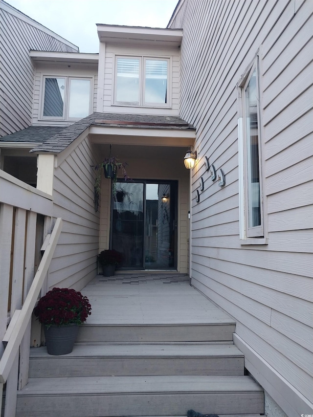 entrance to property with a deck