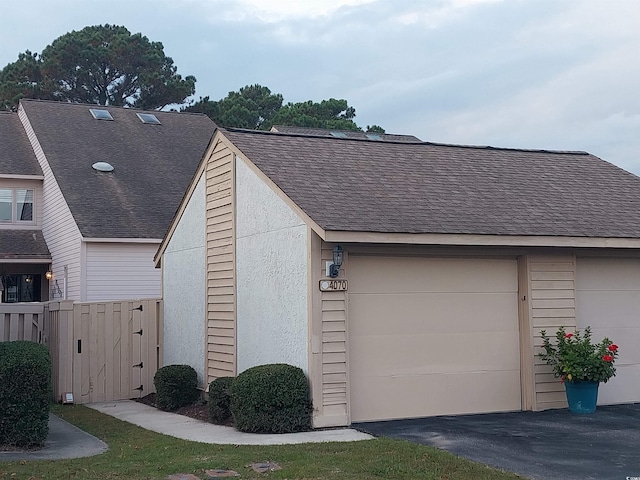 view of side of home featuring a garage