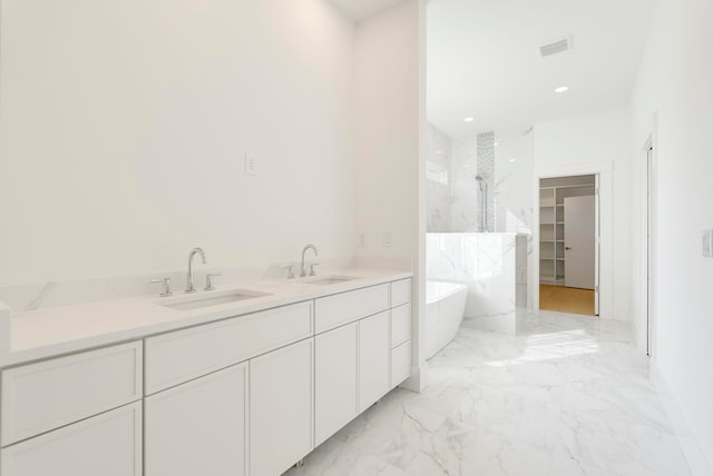 bathroom with independent shower and bath and vanity