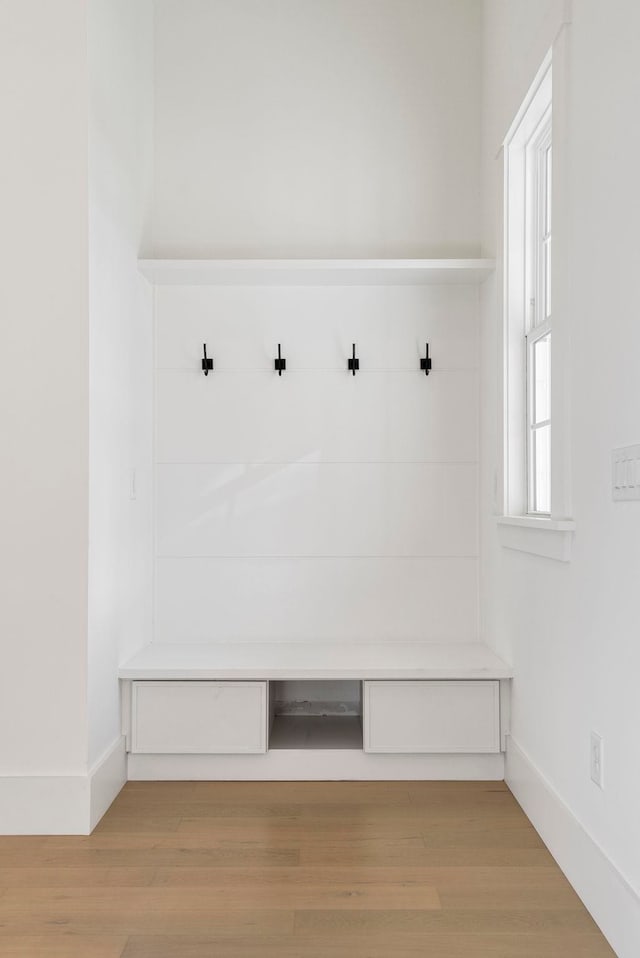 mudroom with light hardwood / wood-style flooring