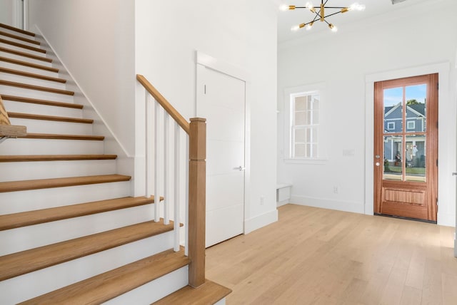 2313 Summersweet Ln, Myrtle Beach, SC 29579 - entrance foyer featuring stairway, a chandelier, and light wood-style flooring