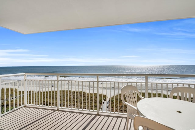 balcony with a view of the beach and a water view