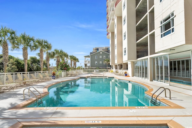 view of swimming pool with a patio