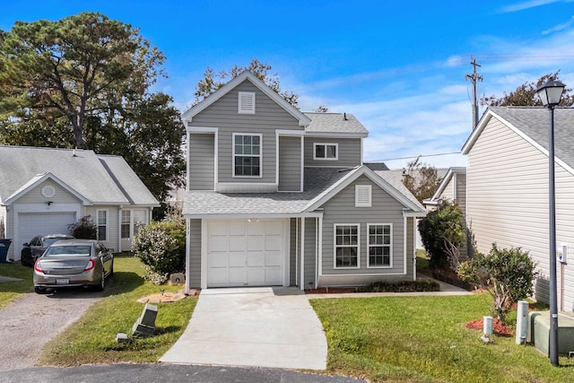 view of property with a garage and a front lawn