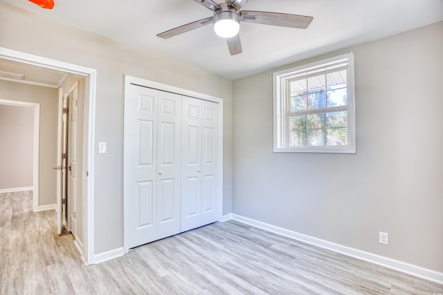 615 1st Ave N, Surfside Beach, SC 29575 - unfurnished bedroom featuring light wood-style flooring, baseboards, a closet, and ceiling fan