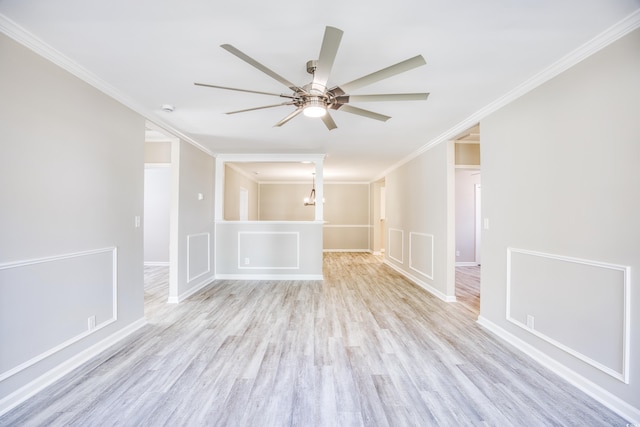 615 1st Ave N, Surfside Beach, SC 29575 - spare room featuring ornamental molding, light wood-style flooring, ceiling fan, a chandelier, and baseboards