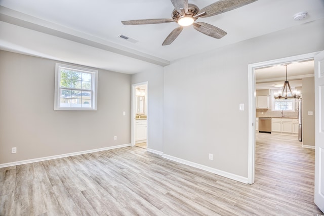 615 1st Ave N, Surfside Beach, SC 29575 - spare room with light wood-style floors, a chandelier, plenty of natural light, and a smoke detector