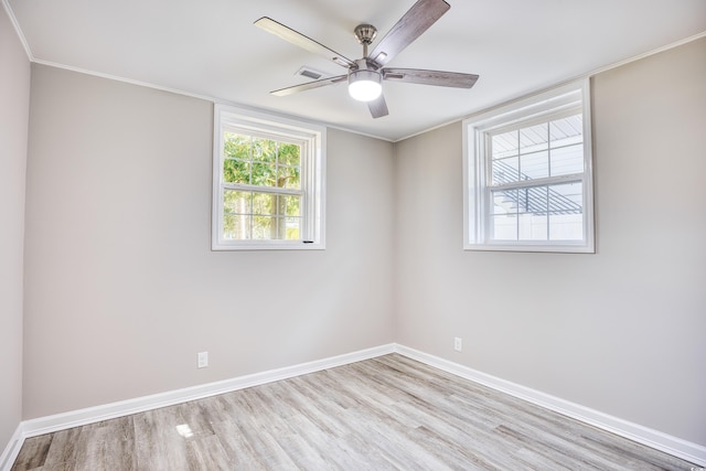 615 1st Ave N, Surfside Beach, SC 29575 - empty room featuring wood finished floors, baseboards, ceiling fan, and ornamental molding