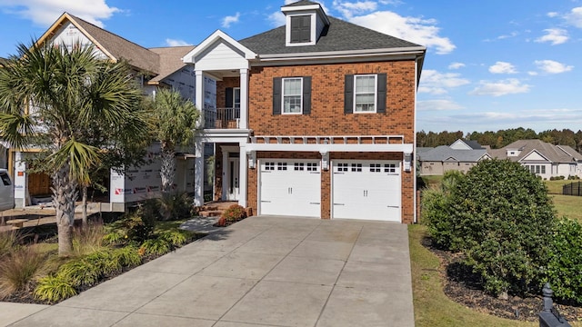 view of front of property with a balcony and a garage