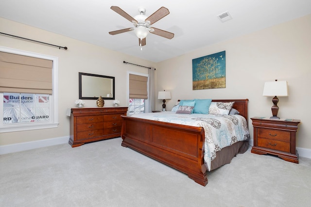 bedroom featuring light carpet and ceiling fan