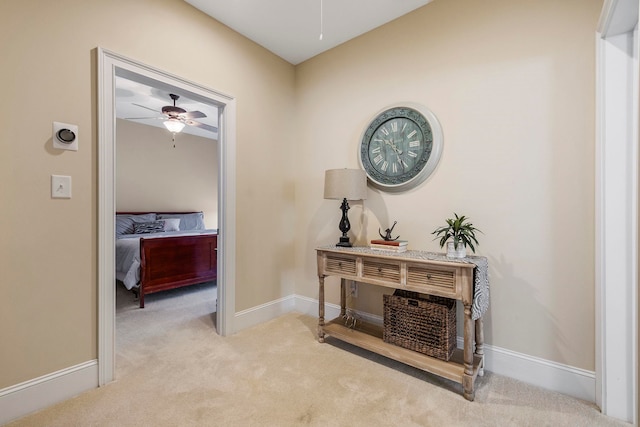 corridor with light colored carpet