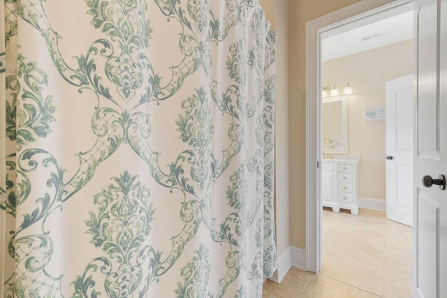 bathroom featuring vanity and tile patterned flooring