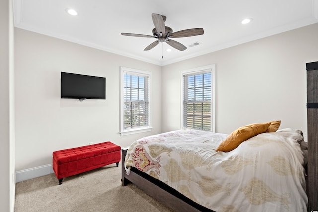 bedroom with carpet flooring, ceiling fan, and crown molding