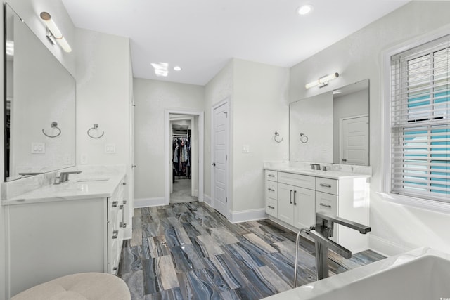 bathroom featuring wood-type flooring and vanity