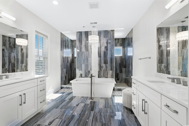 bathroom with vanity, plus walk in shower, and a notable chandelier