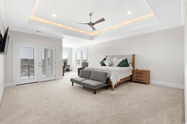 carpeted bedroom featuring ceiling fan, a raised ceiling, french doors, and access to outside