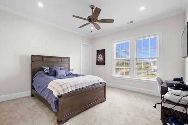 carpeted bedroom featuring ceiling fan and crown molding