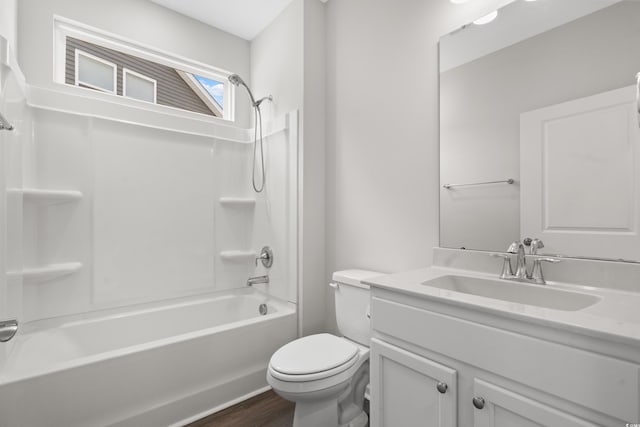 full bathroom featuring wood-type flooring, vanity, toilet, and shower / bathing tub combination