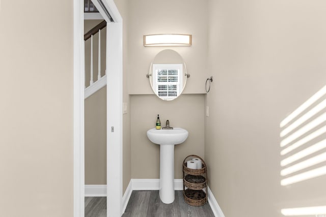 bathroom with sink and hardwood / wood-style floors