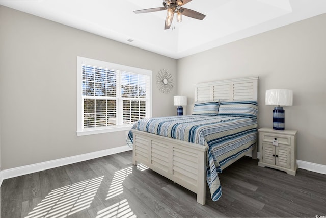 bedroom with dark wood-type flooring and ceiling fan