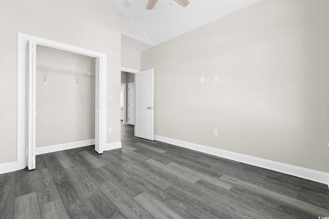 unfurnished bedroom featuring dark wood-type flooring, a closet, high vaulted ceiling, and ceiling fan