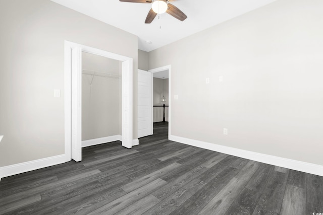 unfurnished bedroom featuring dark hardwood / wood-style flooring, a closet, and ceiling fan