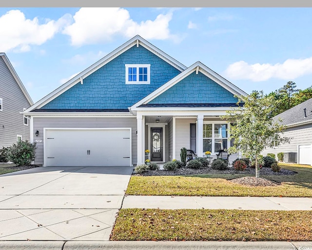 view of front of property with a garage and covered porch