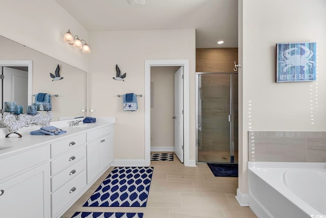 bathroom featuring shower with separate bathtub and vanity