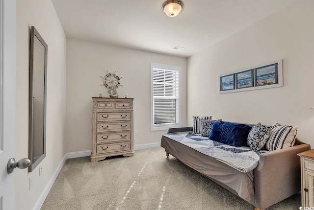 living area with light colored carpet