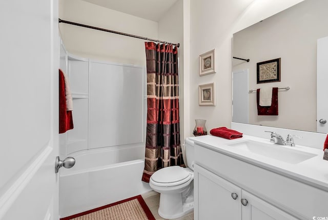 full bathroom featuring shower / bath combo with shower curtain, tile patterned flooring, vanity, and toilet