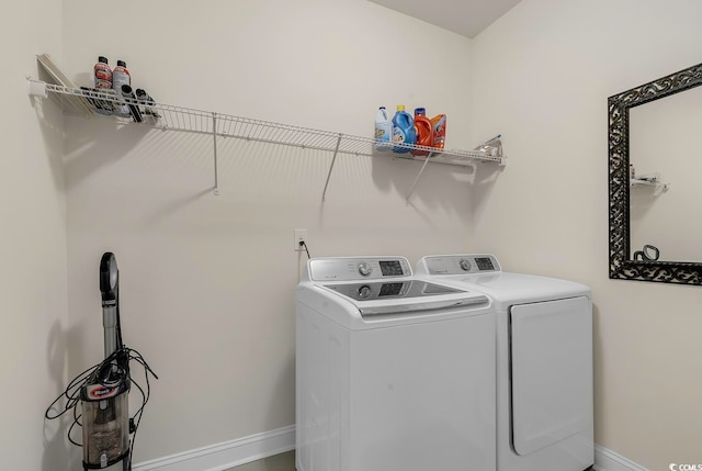 washroom featuring washer and clothes dryer