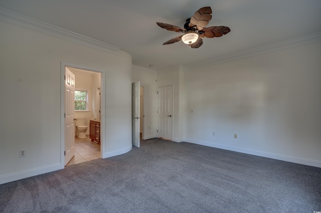 unfurnished bedroom featuring ceiling fan, connected bathroom, crown molding, and light colored carpet