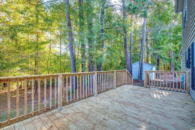 wooden terrace featuring a storage shed