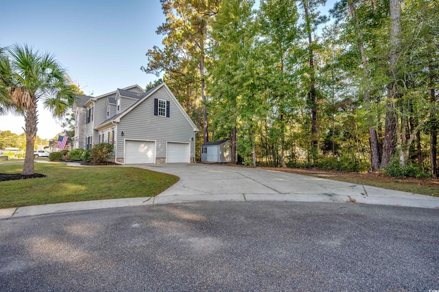 exterior space with a garage and a yard