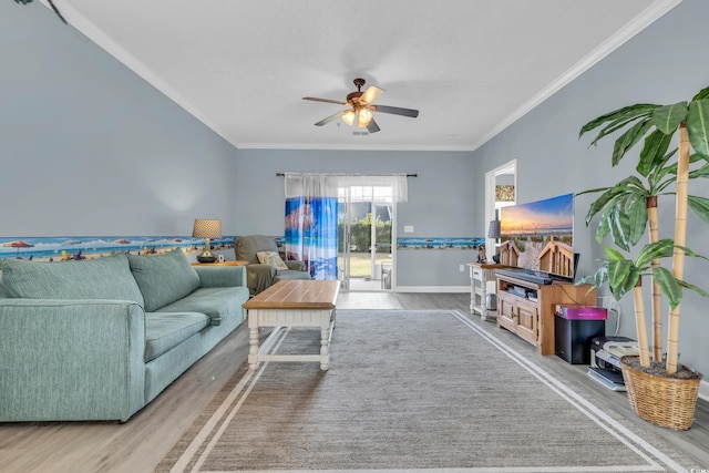 living room with wood-type flooring, ceiling fan, and ornamental molding