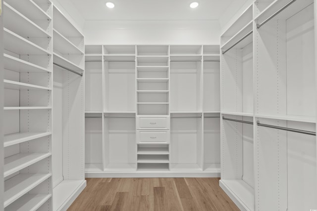 spacious closet featuring light hardwood / wood-style floors