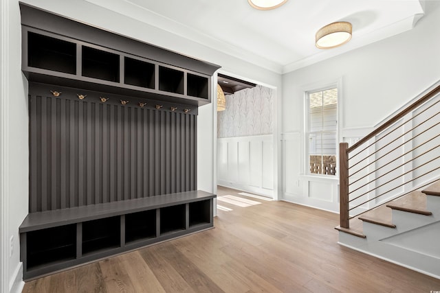 mudroom with hardwood / wood-style floors and ornamental molding