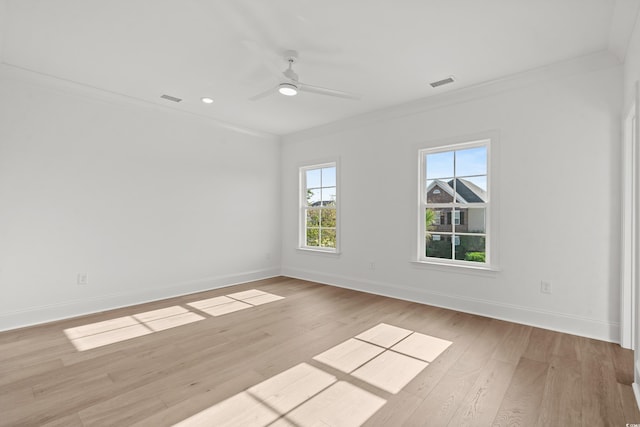 spare room with ceiling fan, light hardwood / wood-style flooring, and ornamental molding