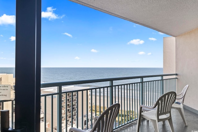 balcony featuring a water view