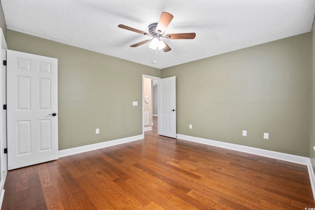 unfurnished bedroom with hardwood / wood-style floors, ceiling fan, and a textured ceiling