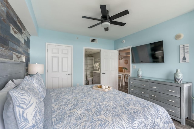 bedroom with connected bathroom and ceiling fan