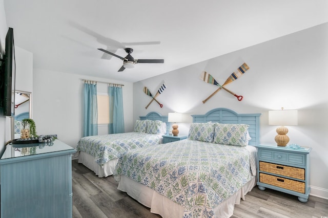 bedroom featuring ceiling fan and wood-type flooring