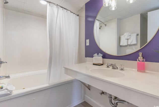 bathroom with sink and shower / bathtub combination with curtain