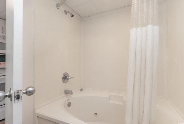 bathroom with shower / bath combo with shower curtain