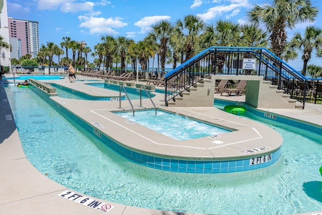 view of pool with a community hot tub