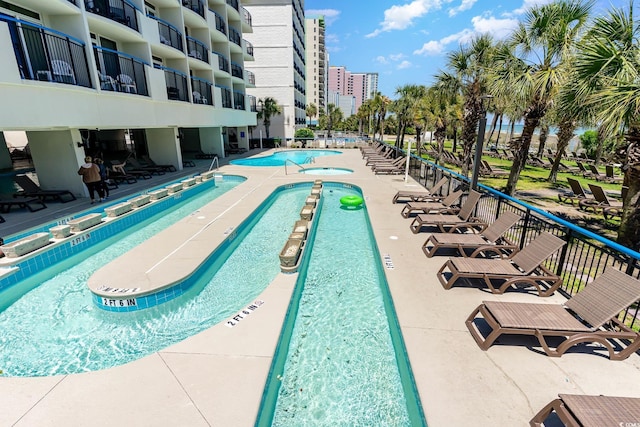 view of swimming pool featuring a patio