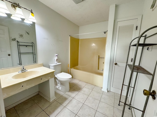 full bathroom featuring vanity, a textured ceiling, shower / washtub combination, tile patterned flooring, and toilet