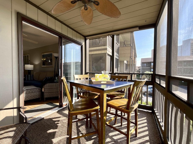 sunroom / solarium with ceiling fan and plenty of natural light