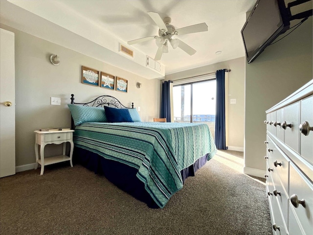 bedroom featuring access to exterior, ceiling fan, and dark colored carpet